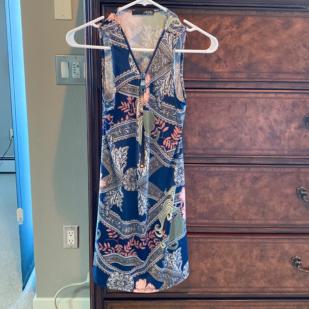 Only worn once. Cute dress with zipper front you can dress it up or down.